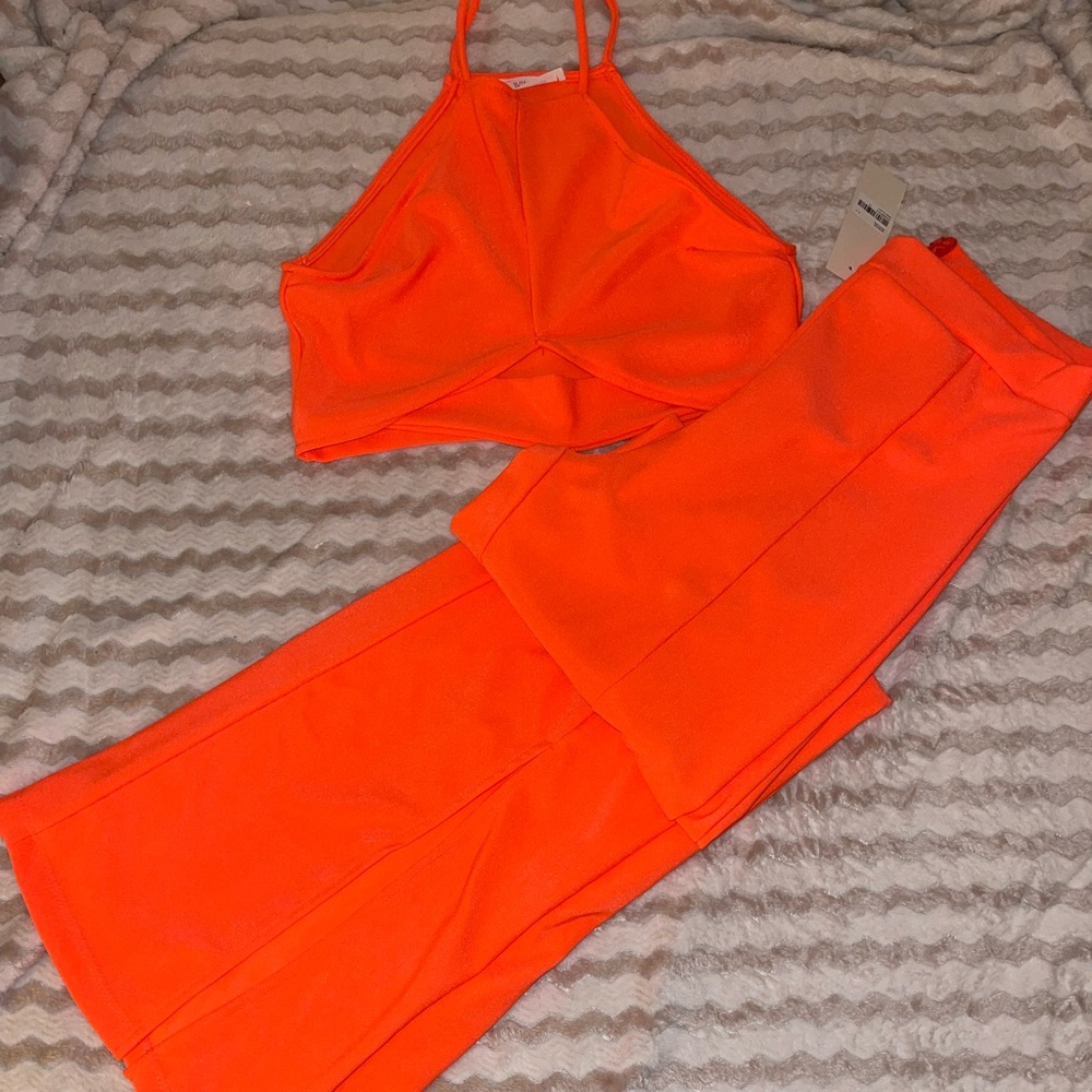 WinWin Neon Coral 2 piece crop top and high waisted wide legged pant set.